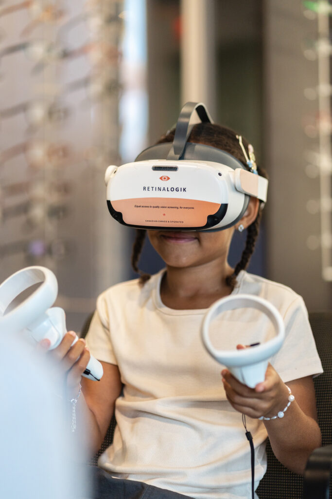 Child completing guided visual field testing using a RetinaLogik headset